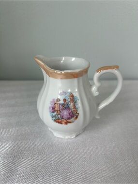 White Porcelain Creamer with Gold Trim and Vintage Romantic Scene